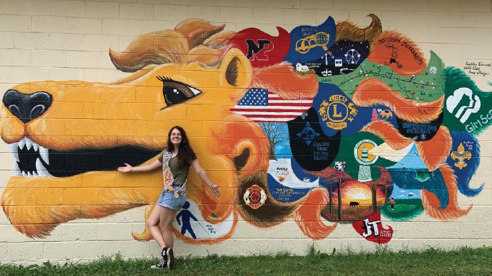 Girl Scout Gabrielle Edwards painted a mural as her Gold Award project and to give back to the local Lions banquet hall where she and her family spent so much of their time.