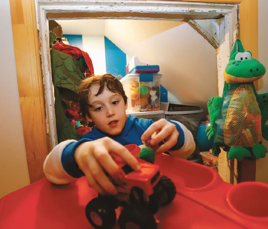 Peter McHugh plays in his room, renovated with the help of Lions. PHOTO BY THE CANADIAN PRESS IMAGES/PATRICK DOYLE