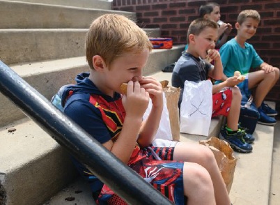 Boys in Frostburg enjoy their lunches. Photo by Justin Merriman