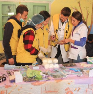 Doctors with Lions Club Doctors Unité discuss their action plan at a recent medical outreach project.