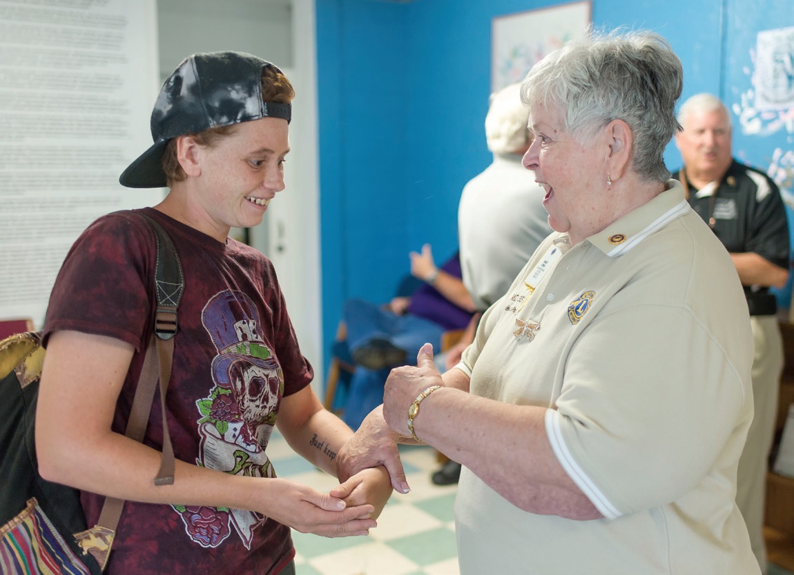 Past District Governor Shirley LePage assures Eva Caraballo, 22, that the Dade City Lions will get her the eye care she needs. PHOTOS BY ZACK WITTMAN