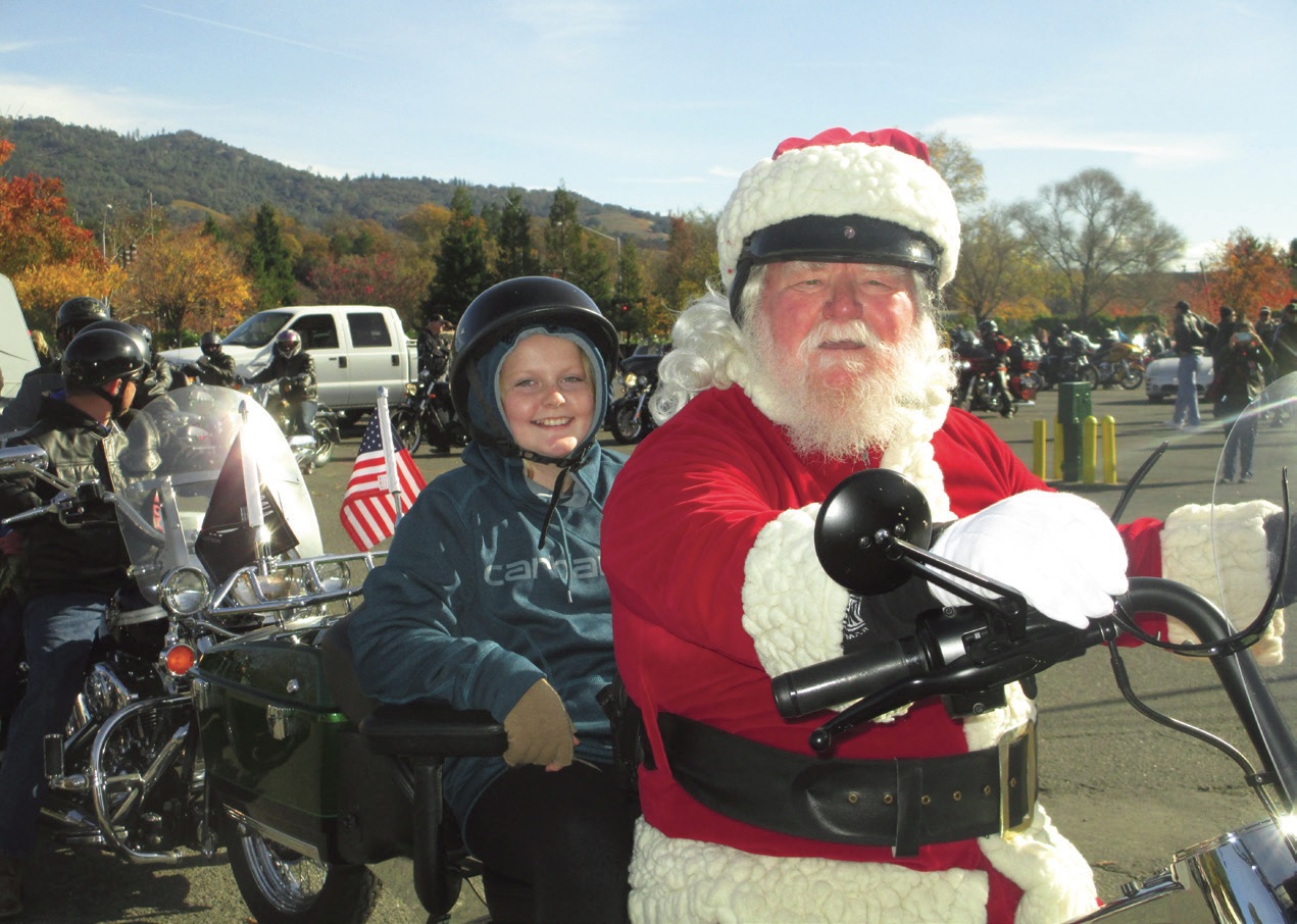 Lion John Turner has been the jolly Santa providing free rides on the back of his “sleigh” for each of the 21 years the Cloverdale Lions have hosted their annual Toy Run in California.