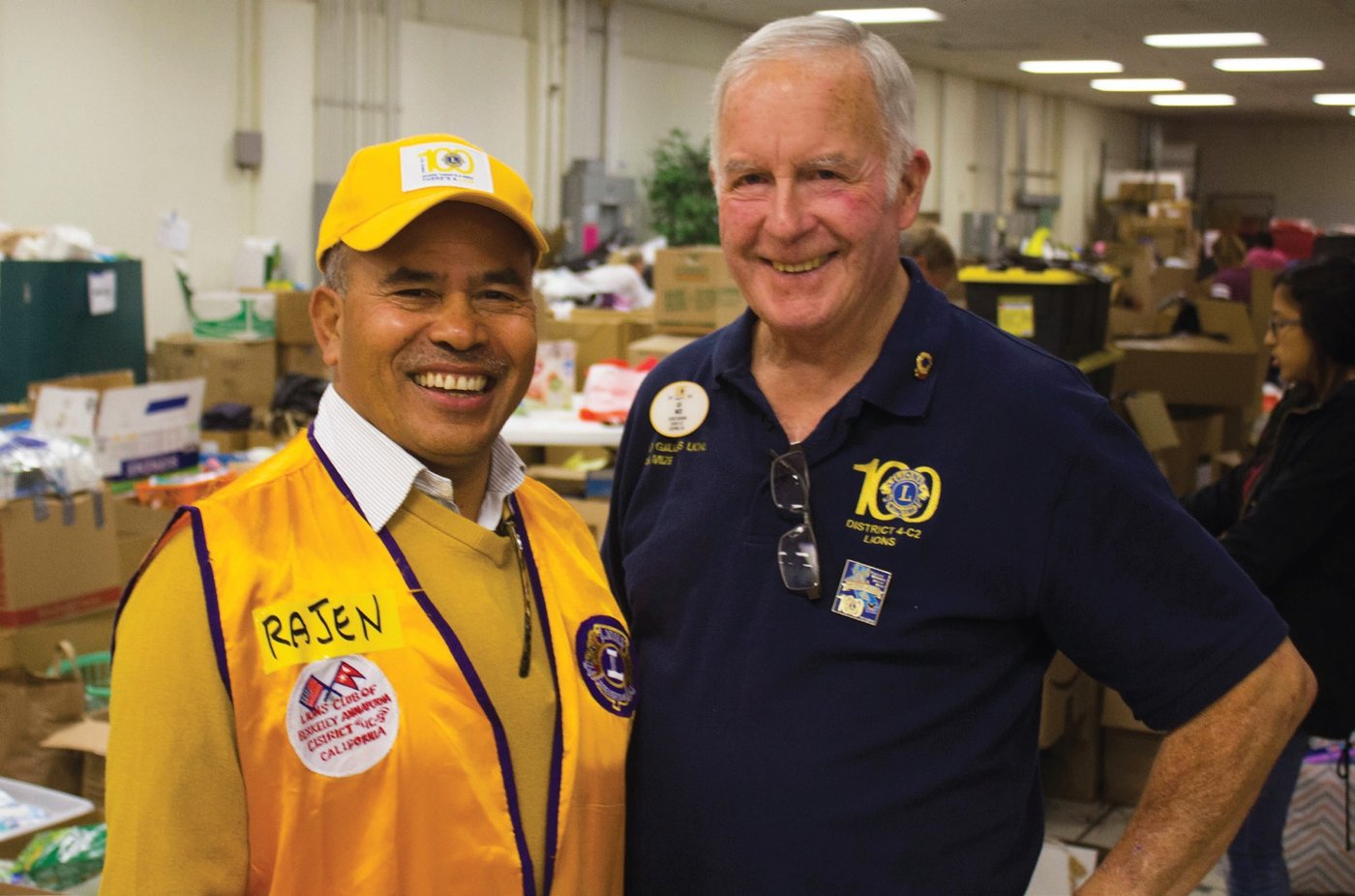 Rajen Thapa, left, with then Lions District Governor of 4-C2 Les Mize help out after the 2017 fires in Santa Rosa, California. As a young boy in Nepal, Thapa dreamed of getting all Nepalese children an education. After moving to the U.S. he’s successfully started a Lions movement in the Nepalese community in California, where they’ve built schools to help children connect to their cultural roots. Photo by Katya Cengel.