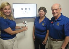 Lions Pam Lundberg, Linda Benner, and Steve Jasper in the eye clinic founded and supported by James City Lions.