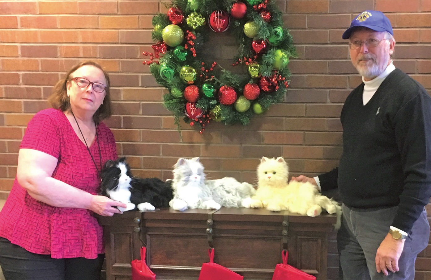 Lion Bill Crabtree and Activities Director Kim Skinner Show off three additional pets donated by the Lancaster Lions this past Christmas.