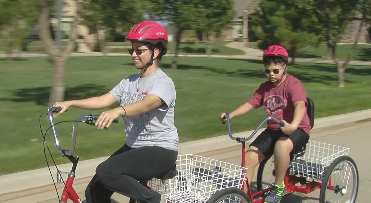 Raquel and her son, Ivan, who is blind, ride in tandem on a specially fitted bike.