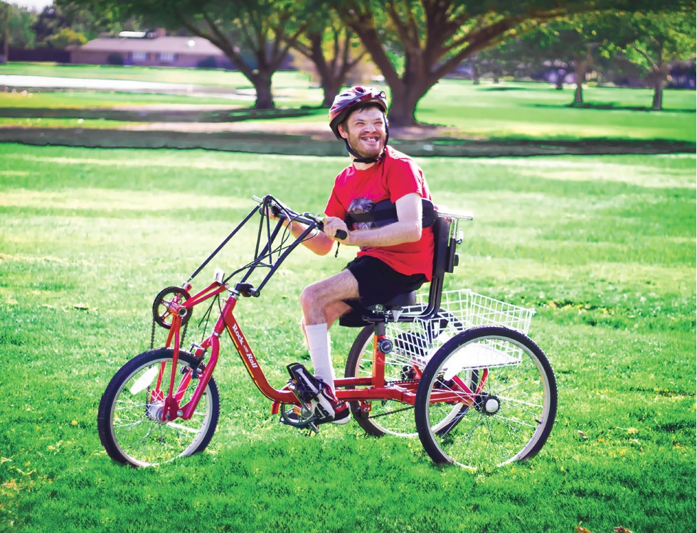 Jerrod Meyers feels the freedom of mobility in his specially adapted cycle courtesy of the Cycle for Life program, sponsored by Lions. Photo by Kelsey Hart.