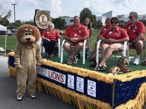 Pickerington Lions pose on their float.
