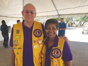 Man and woman in Lions Clubs vests