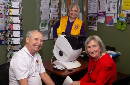 Lions club members pose with screening equipment