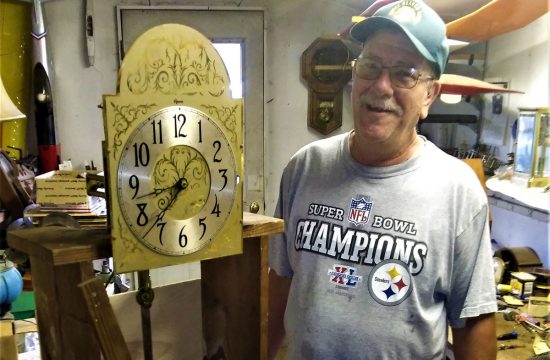 Man with old clock