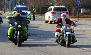 Santa and the grinch on the motorcycle