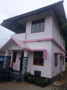 Rebuilt house with pink trim