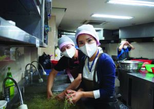 Volunteers working in a kitchen