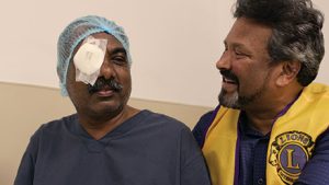 Lions CLubs INternational member with eye surgery patient