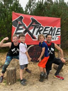 Family celebrates completing a mud run