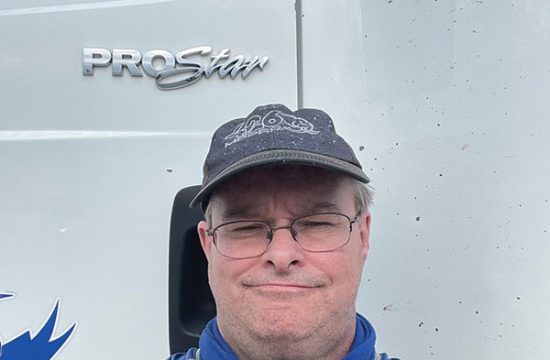 Man taking selfie in front of truck