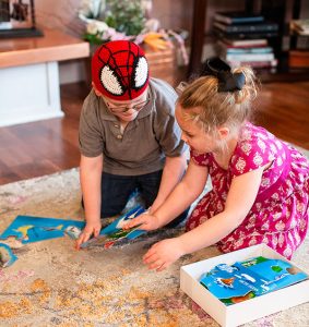 Children do a puzzle together