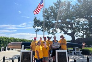 Seal beach Lions pose with restored war memorial