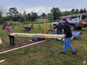 Volunteers build raised garden beds