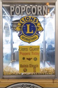 Popcorn machine with Lions emblem.